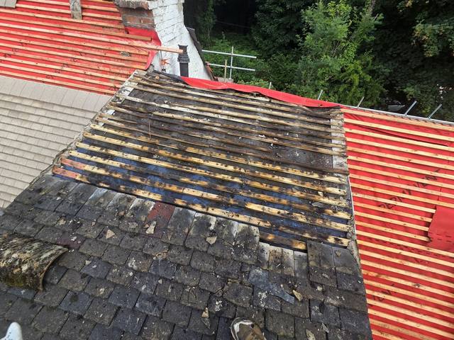 New breathable membrane and battens being installed