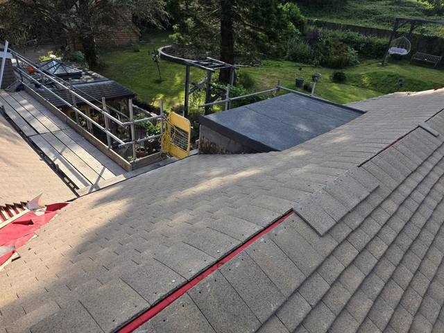Finished ridge with re-covered flat-roof dormers — PGA Installations roofing project