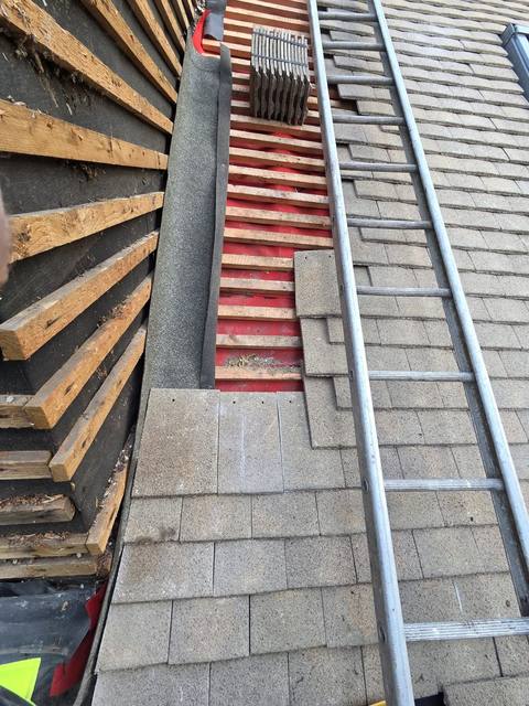 Valley detail where new work meets the existing roof — PGA Installations roofing project