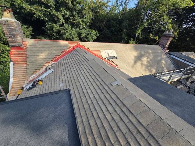 Completed slopes with new high-performance flat roof — PGA Installations roofing project