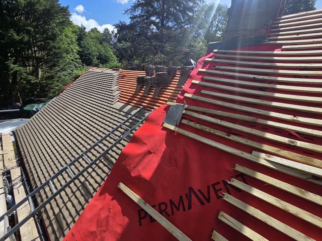 New membrane and battens beside freshly tiled slope — PGA Installations roofing project