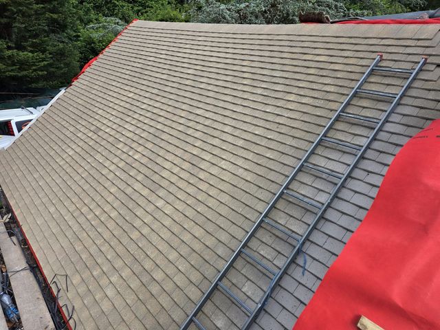 Fresh plain tiles finished across the main slope — PGA Installations roofing project