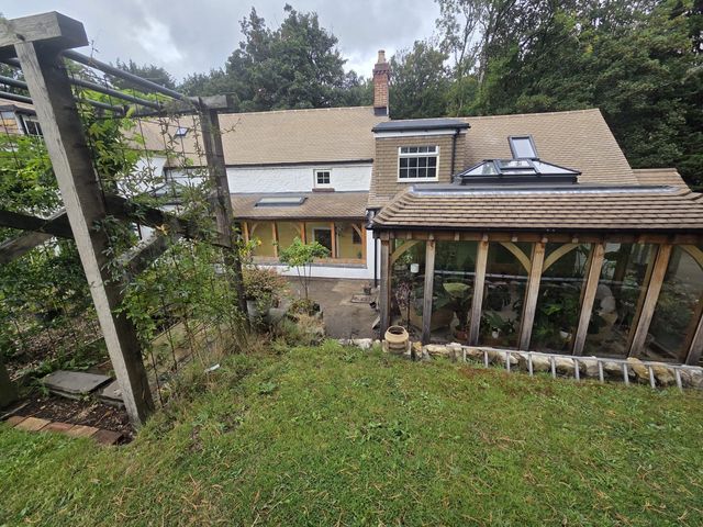 Completed cottage re-roof including garden room — PGA Installations roofing project