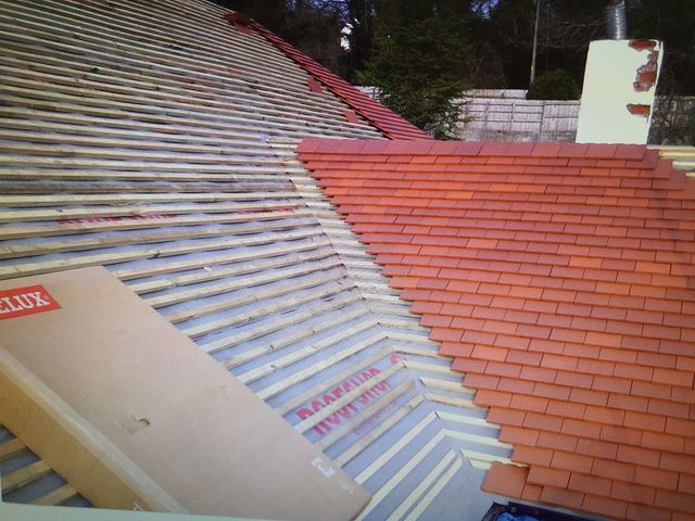 Re-roof mid-tiling with membrane and battens exposed — PGA Installations roofing project