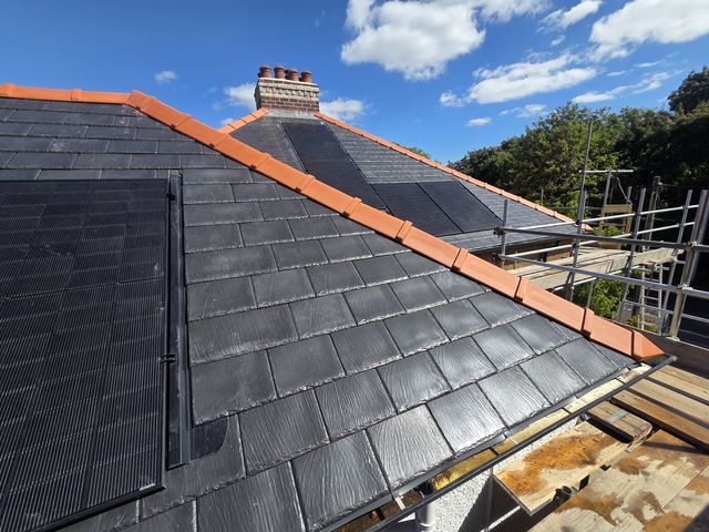 In-roof solar panels flush with slate-look roof — PGA Installations roofing project