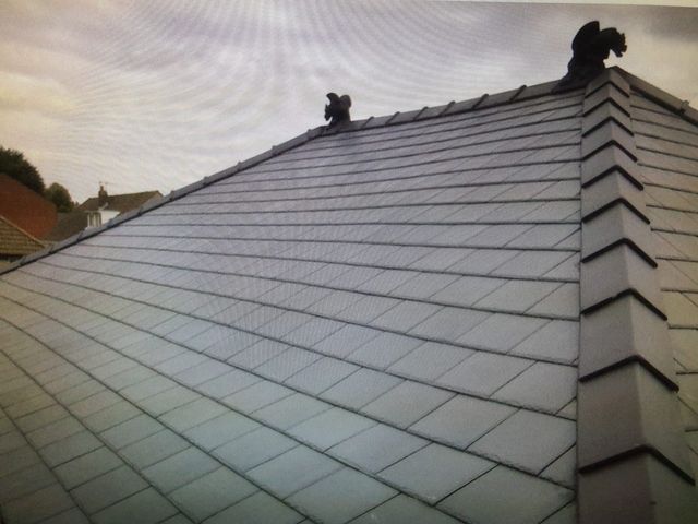 Completed roof with ornamental ridge finials — PGA Installations roofing project